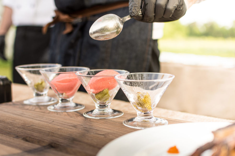 Chef plating sorbeto in glass bowls