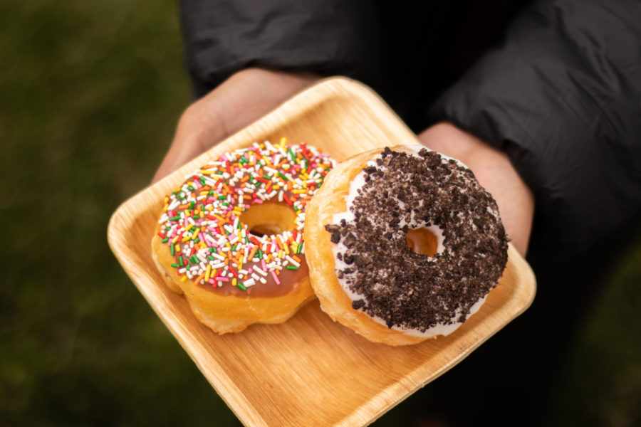 Granny's Donuts. One donut with sprinkles and one with oreo crumbles